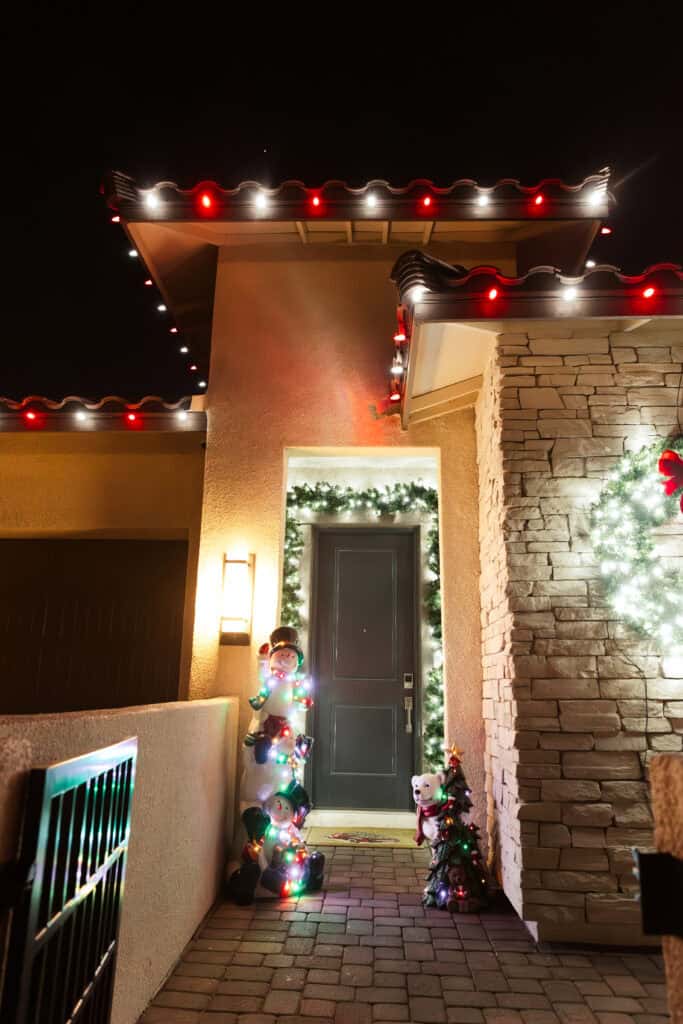 Candy cane red and white Christmas light installation on a Las Vegas home