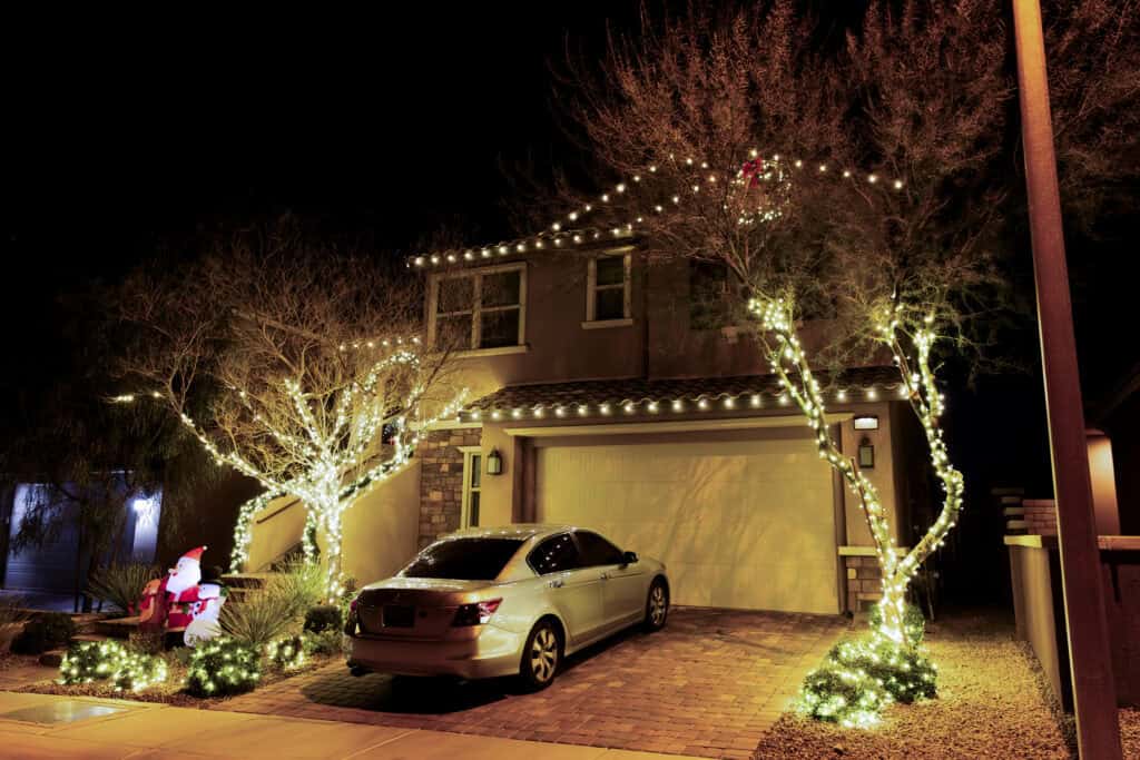 Warm white Christmas light installation on a Las Vegas home