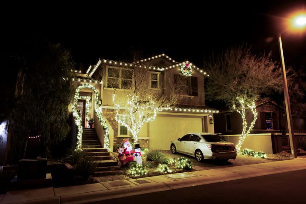 Warm white Christmas light installation on a Las Vegas home