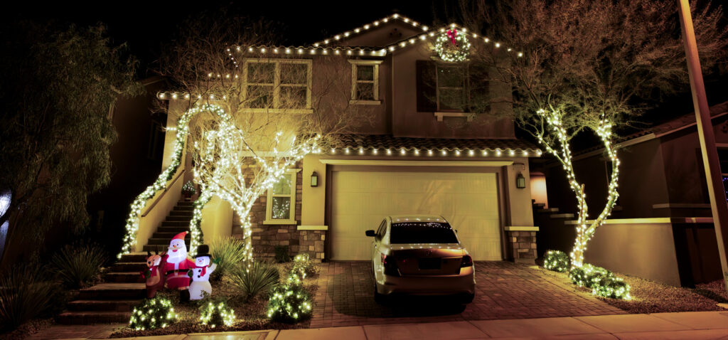 Warm white Christmas light installation on a Las Vegas home