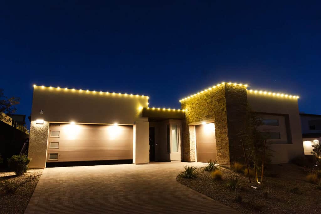 Warm white Christmas light installation on a Las Vegas home