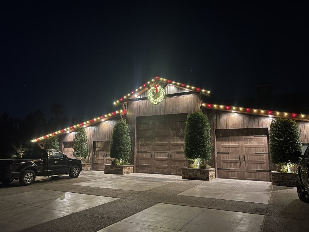 Warm White and Red Candy Cane Christmas Lights installed on a garage door