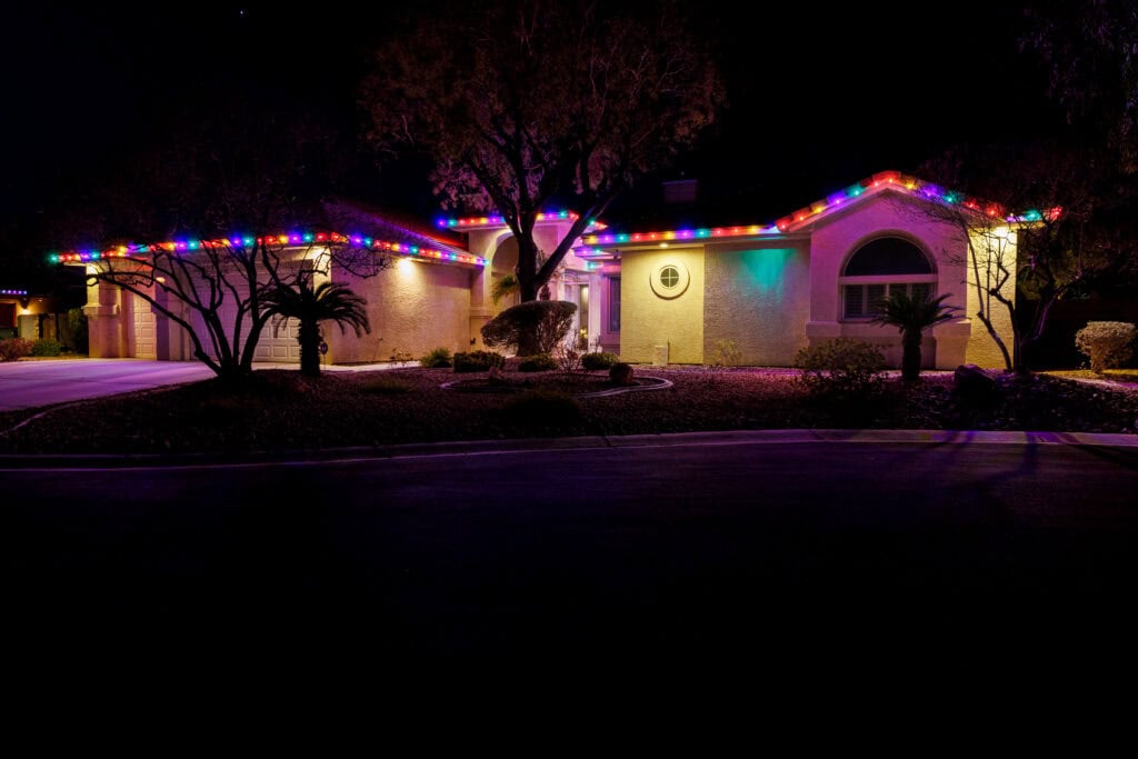 Multi-color custom Christmas light installation on a Las Vegas home