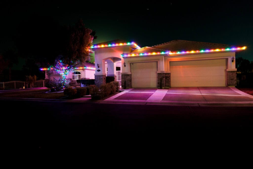 Multi-color custom Christmas light installation on a Las Vegas home