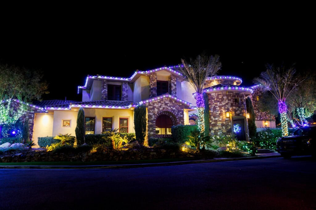 Multi-color custom Christmas light installation on a Las Vegas home