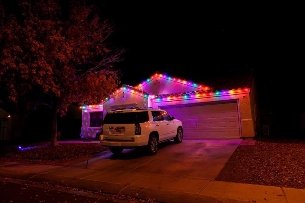 Multi-color custom Christmas light installation on a Las Vegas home