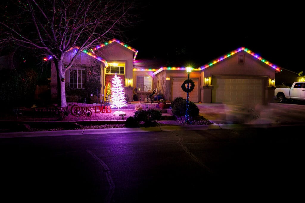 Multi-color custom Christmas light installation on a Las Vegas home