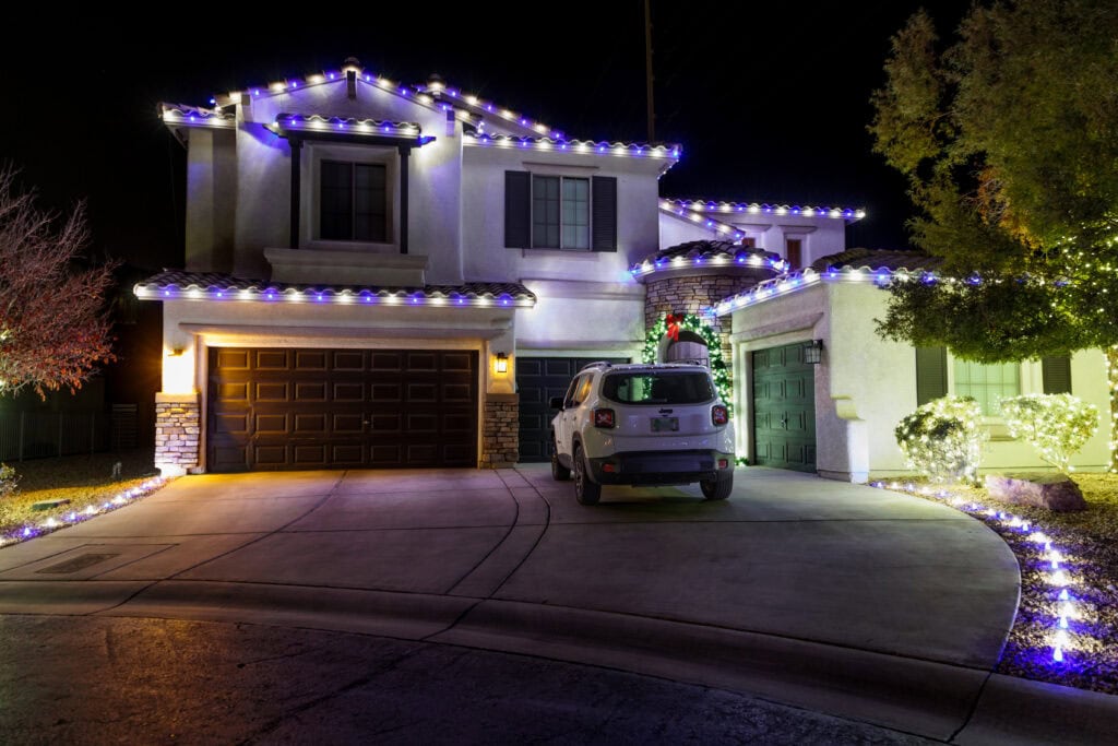 Multi-color custom Christmas light installation on a Las Vegas home
