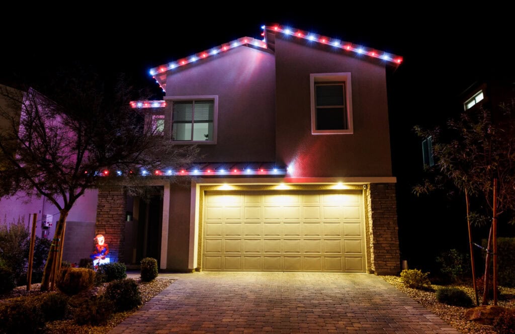Candy cane red and white Christmas light installation on a Las Vegas home