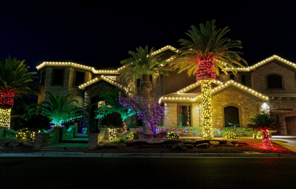 durable christmas lights installed on homes or businesses, colorful lights wrapped around palm trees in celebration of the holiday season with beautiful decor and great customer service